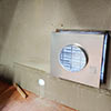 Two installed circular ventilation fans