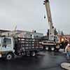 Using crane to unload equipment for Puetz store